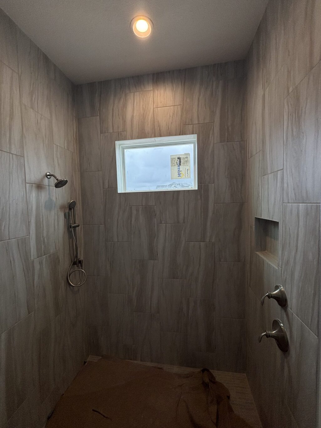 "Custom marble shower installation Jacksonville FL" or "Natural stone wall tile shower St. Augustine."