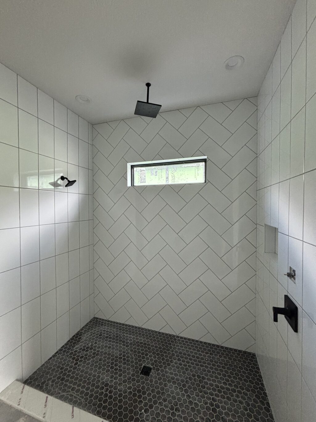 "Custom marble shower installation Jacksonville FL" or "Natural stone wall tile shower St. Augustine."