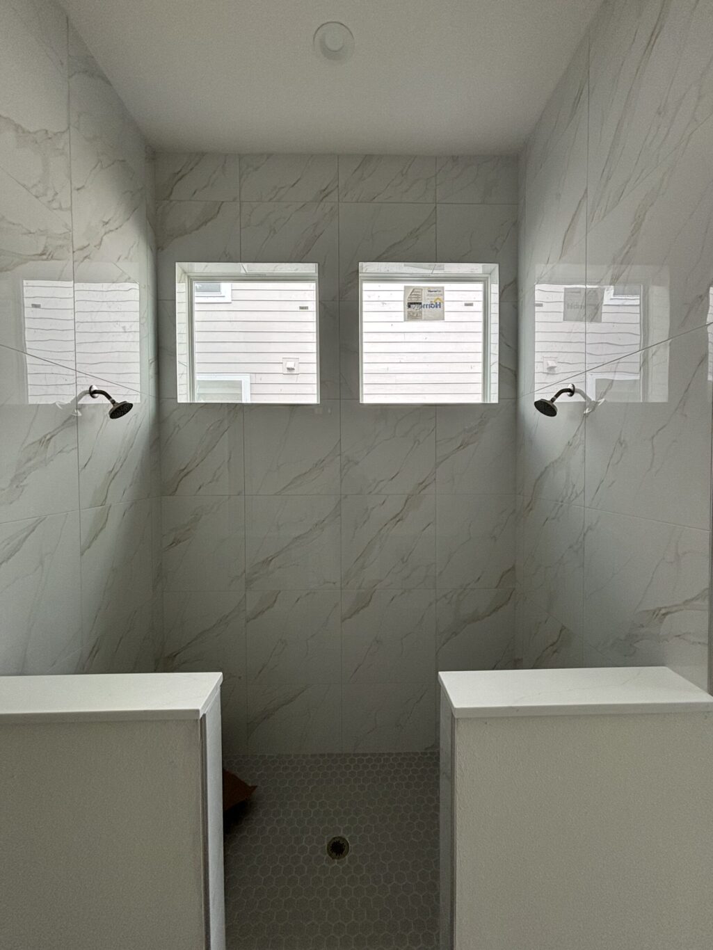 "Custom marble shower installation Jacksonville FL" or "Natural stone wall tile shower St. Augustine."