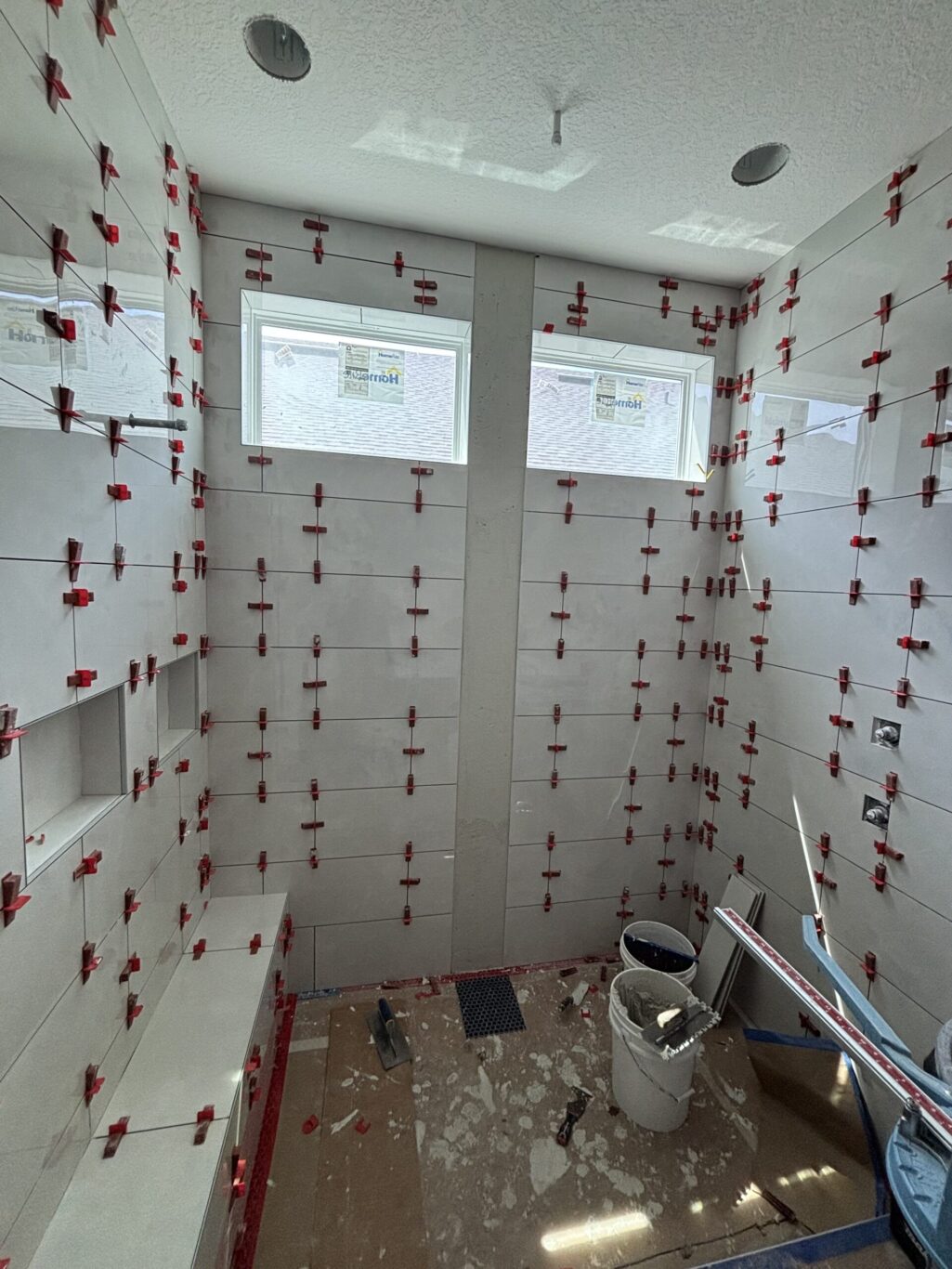 "Custom marble shower installation Jacksonville FL" or "Natural stone wall tile shower St. Augustine."