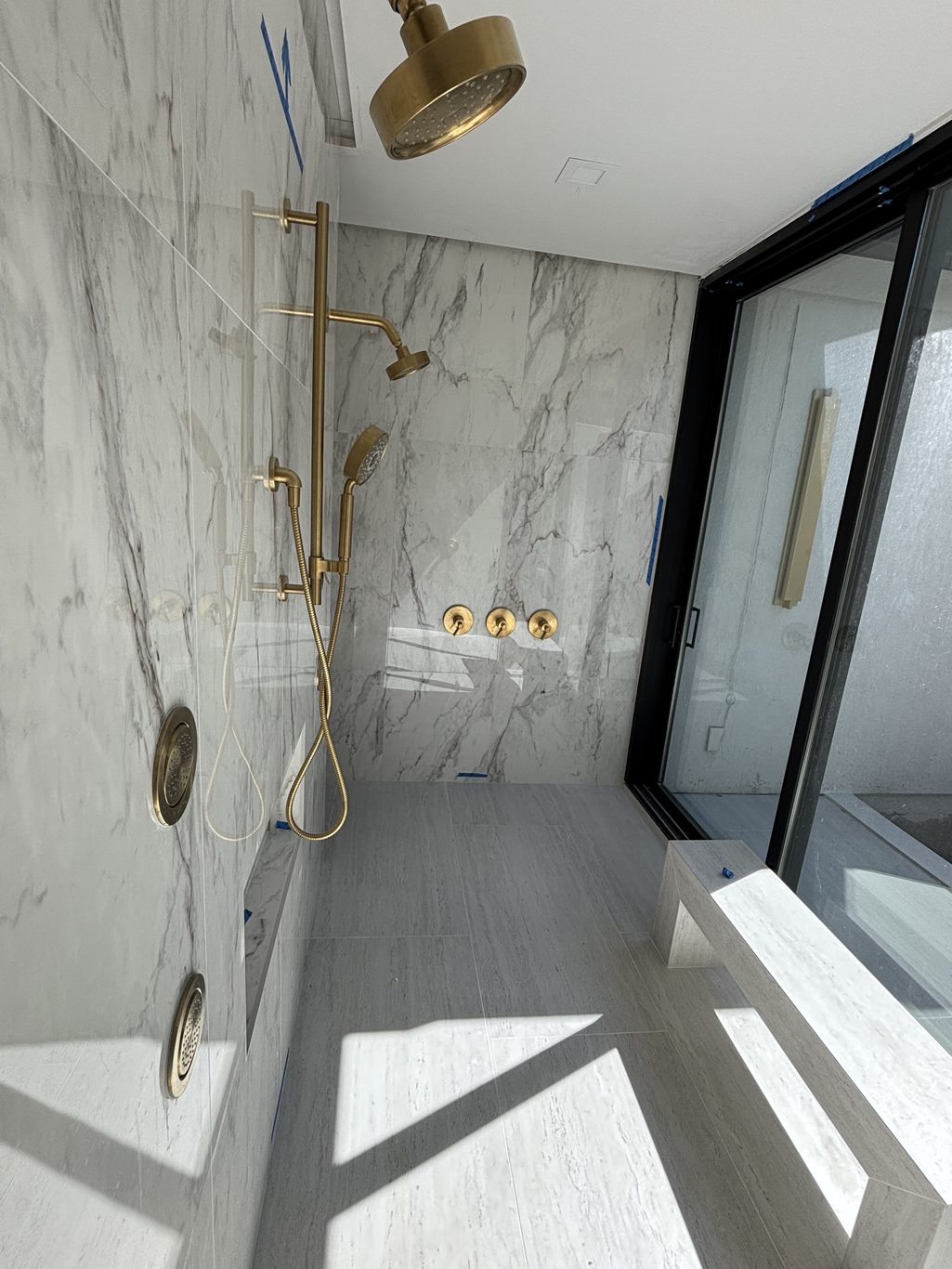 Gold Fixture in Shower
